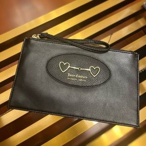 Black juicy couture wristlet with gold accents.